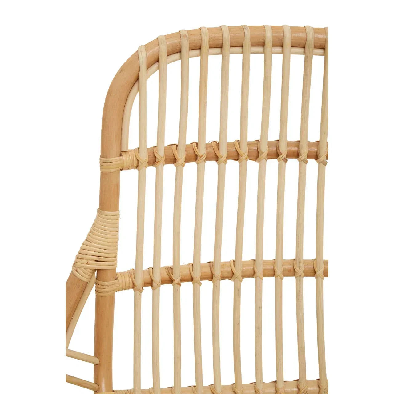 Closeup of natural rattan dining chair backrest with woven design