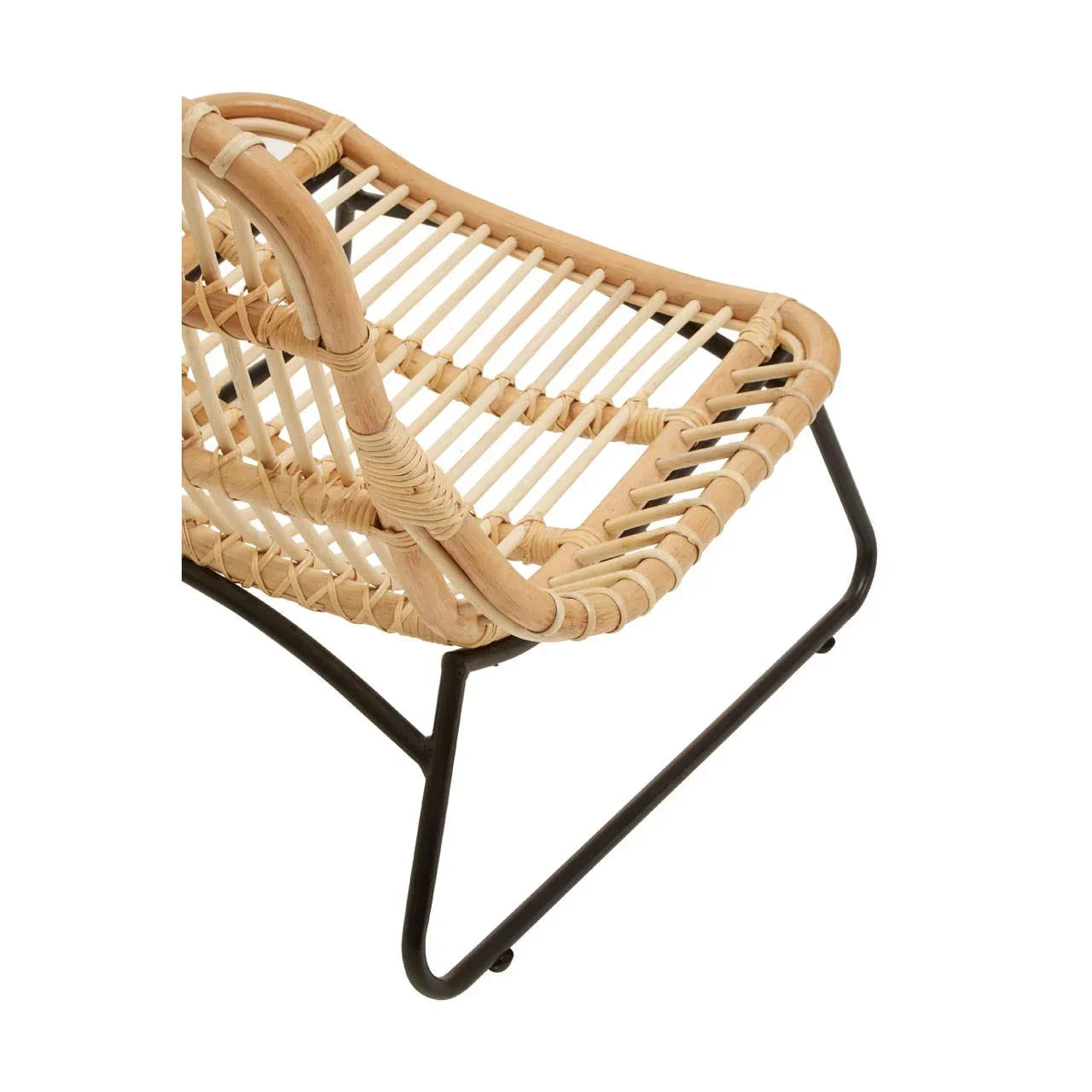 Rattan accent chair with black metal legs and woven seat detail, angled side view