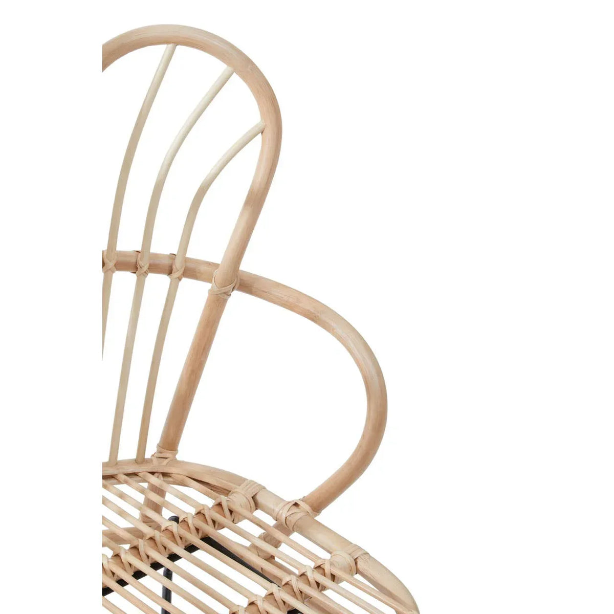 Closeup of rattan chair backrest with curved lines and natural wood finish
