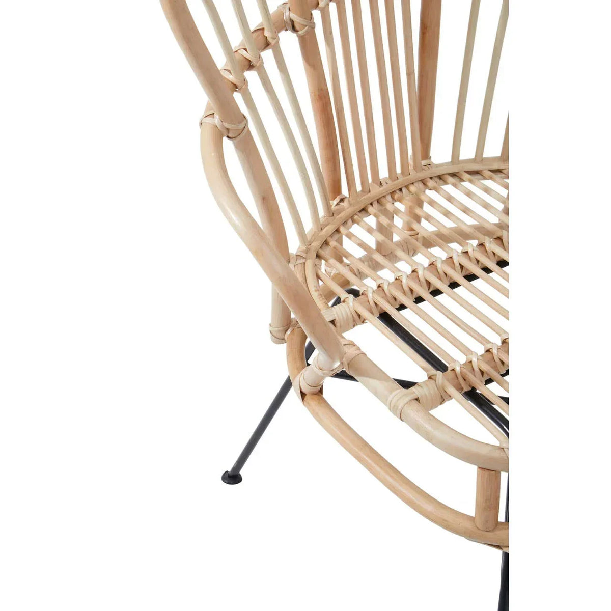 Close-up of rattan armchair seat with curved bamboo frame and black metal legs