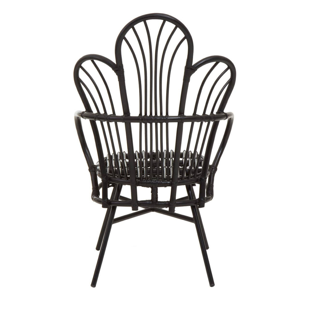 A black metal chair featuring a scalloped back design made from natural rattan, with a round seat and slender legs. The overall structure is elegant and modern, showcasing a combination of materials and a unique silhouette