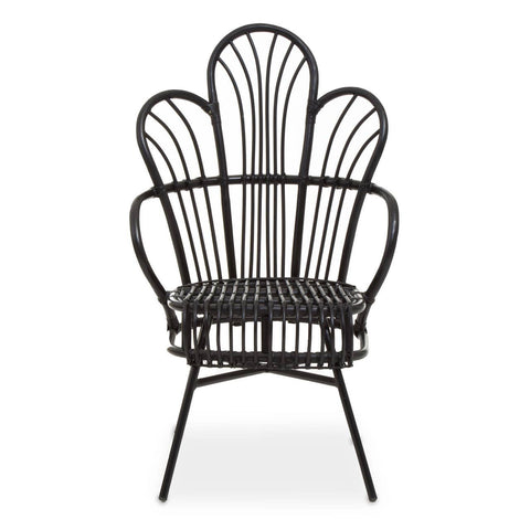 A black metal chair with a scalloped back design, featuring natural rattan accents. The chair has a curved silhouette and slender legs, showcasing a blend of modern and tropical aesthetics. The seat is open and airy, emphasizing the intricate pattern of the backrest