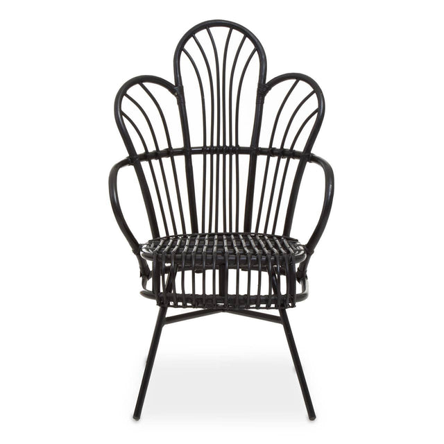 A black metal chair with a scalloped back design, featuring natural rattan accents. The chair has a curved silhouette and slender legs, showcasing a blend of modern and tropical aesthetics. The seat is open and airy, emphasizing the intricate pattern of the backrest