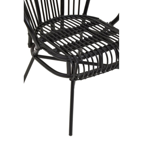 A black metal chair featuring a scalloped back design, with a woven natural rattan seat and backrest. The chair has slender legs and an open, airy structure, showcasing a modern aesthetic suitable for home decor