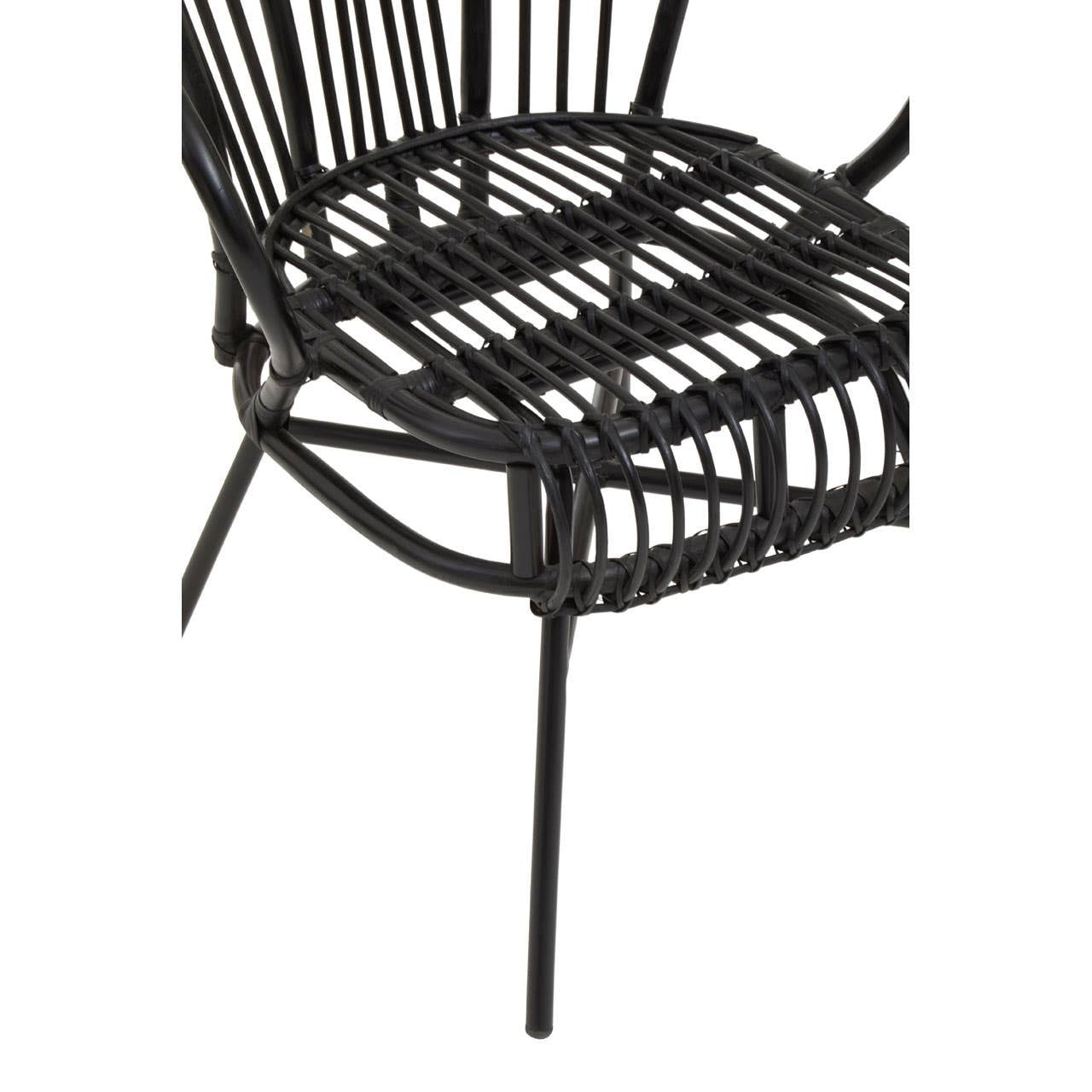 A black metal chair featuring a scalloped back design, with a woven natural rattan seat and backrest. The chair has slender legs and an open, airy structure, showcasing a modern aesthetic suitable for home decor