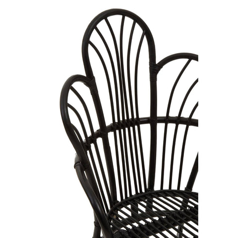 A black metal chair featuring a scalloped back design with natural rattan accents, showcasing a combination of sleek lines and a textured finish. The chair's backrest has a unique, curved shape that adds an elegant touch to its overall aesthetic