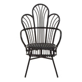 A black metal chair featuring a scalloped back design, with natural rattan detailing woven throughout. The chair has a sturdy base with four slender legs, creating a stylish and contemporary look suitable for home decor