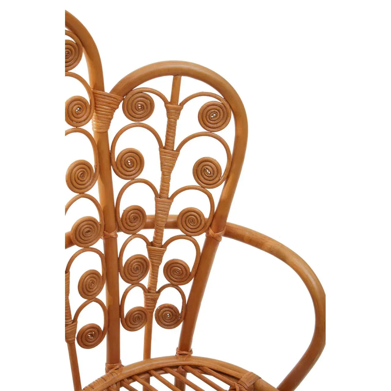 Curved rattan chair back with intricate spiral wicker design and rounded armrest