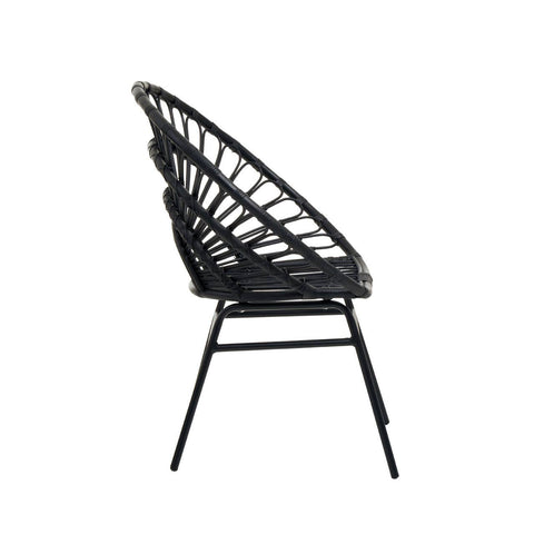 Flared back chair made of black natural rattan, featuring a curved design and slender metal legs, viewed from the side
