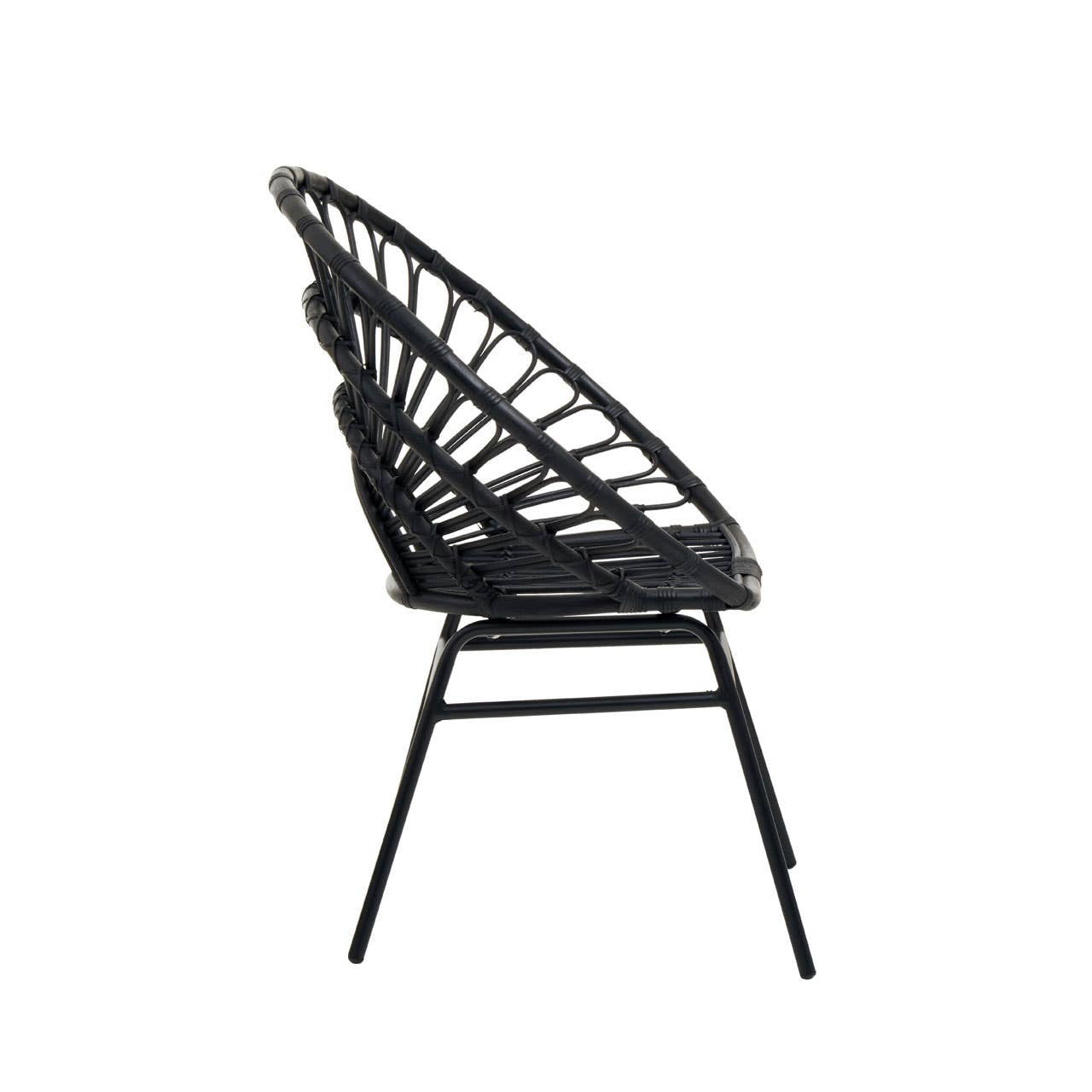 Flared back chair made of black natural rattan, featuring a curved design and slender metal legs, viewed from the side