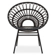 A flared back chair made of black natural rattan, featuring a circular design with a wide, open back and a sturdy metal frame. The chair has four legs and a minimalist aesthetic, suitable for modern home decor