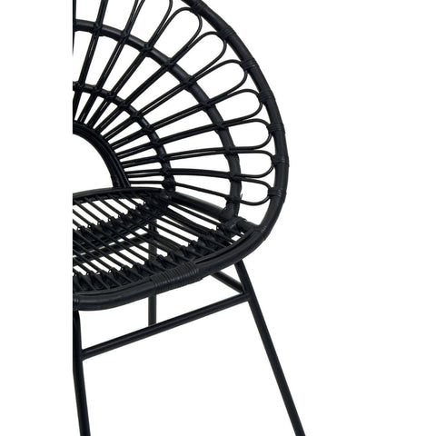 Black rattan flared back chair featuring a circular, open-weave design and a sturdy metal frame, showcasing a modern and stylish aesthetic suitable for home decor