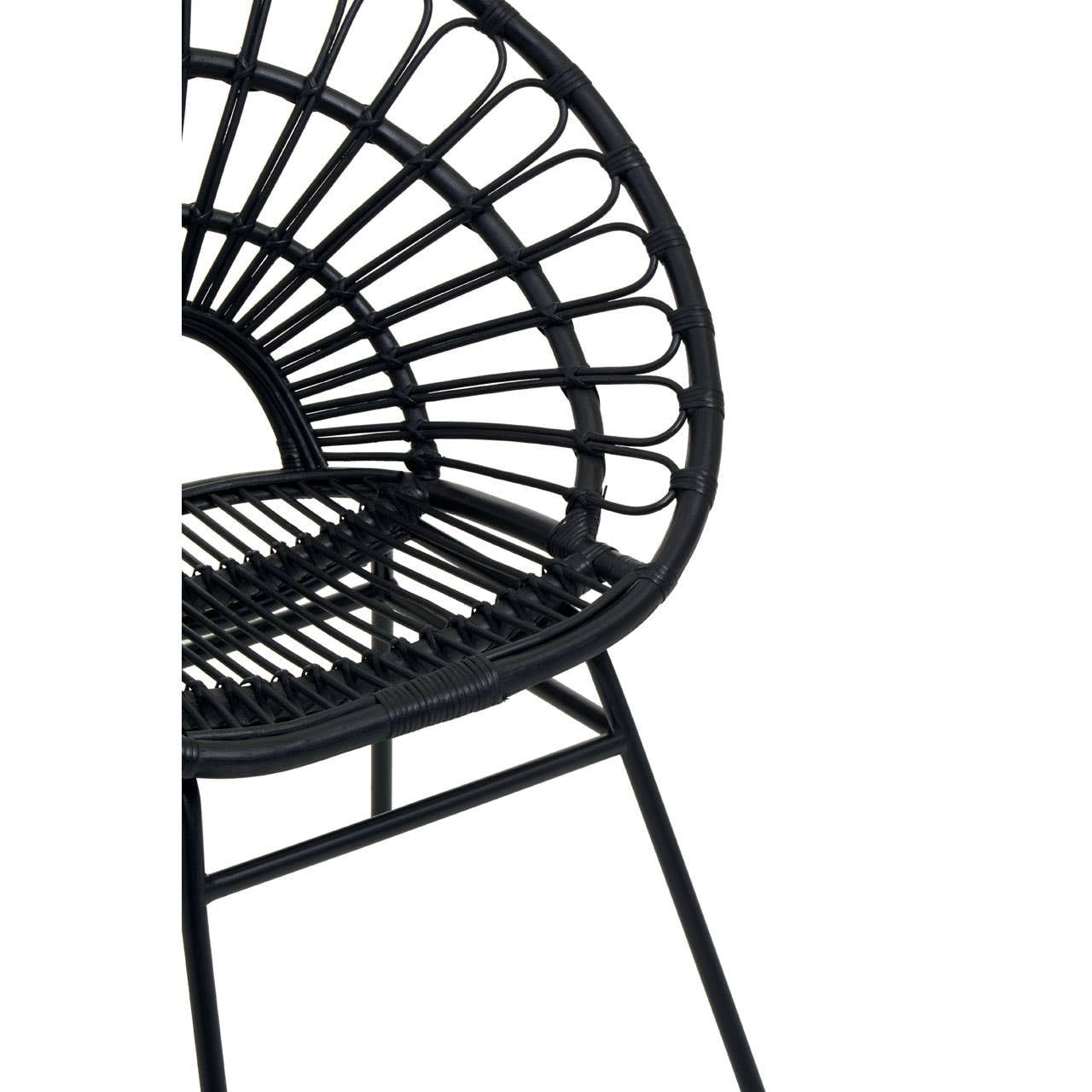 Black rattan flared back chair featuring a circular, open-weave design and a sturdy metal frame, showcasing a modern and stylish aesthetic suitable for home decor