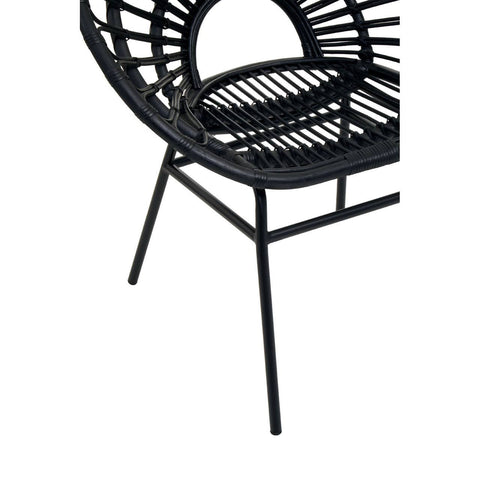 Black rattan flared back chair with a circular seat and open weave design, supported by slender metal legs. The chair features a modern, minimalist aesthetic suitable for various home decor styles