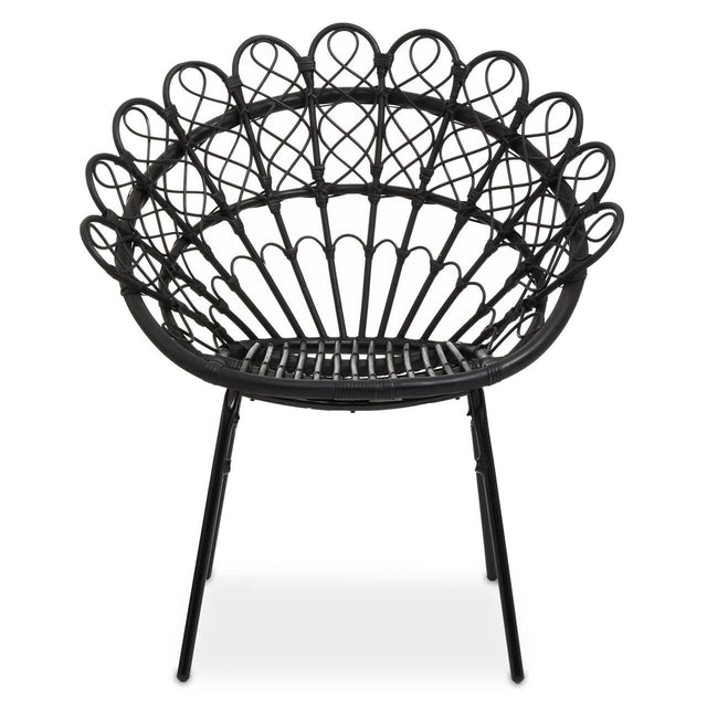 A round black rattan peacock chair with a decorative, fan-shaped backrest and slender metal legs, showcasing a natural woven texture and an open design