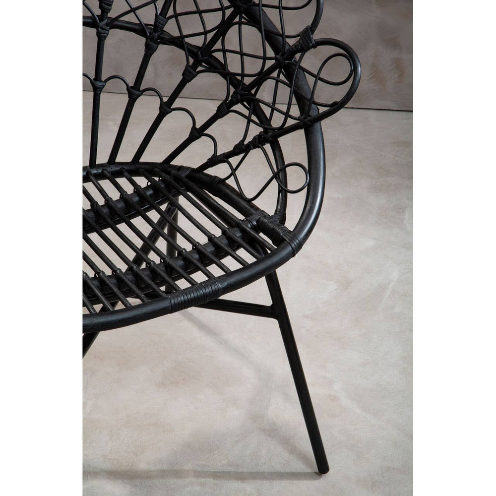 Black natural rattan peacock chair featuring a circular, fan-like backrest and a sturdy metal frame with angled legs, set against a neutral background