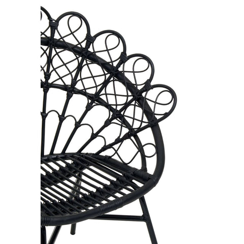 A black natural rattan peacock chair featuring a distinctive fan-shaped backrest with circular patterns, supported by a sturdy frame and a woven seat. The design showcases intricate detailing and a modern aesthetic suitable for home decor