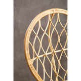 Curved natural rattan chair featuring a unique woven pattern, showcasing a light wood finish against a textured gray background
