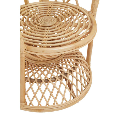 Curved chair made of natural rattan featuring a circular woven seat and a lower shelf with a diamond pattern, showcasing a light, airy design suitable for home decor