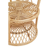 Curved chair made of natural rattan featuring a circular woven seat and a lower shelf with a diamond pattern, showcasing a light, airy design suitable for home decor