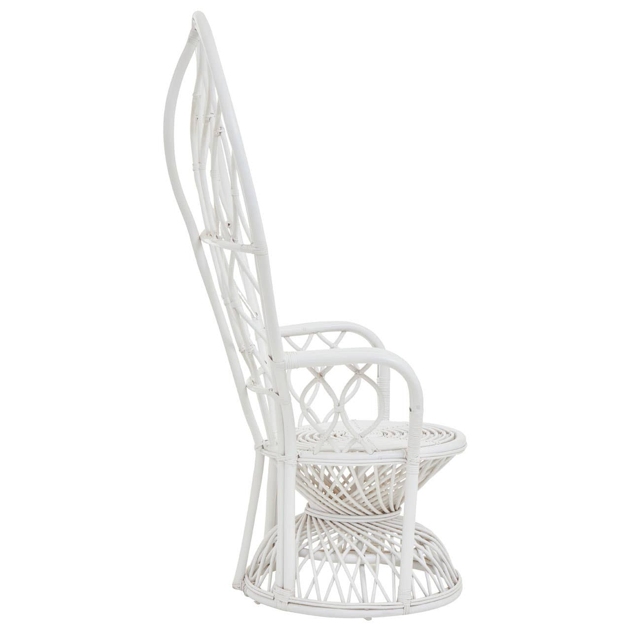 Curved chair made of natural rattan featuring a grey and white color scheme, showcasing a tall, elegant backrest and a rounded seat design. The chair has intricate weaving patterns and a sturdy base, ideal for home decor