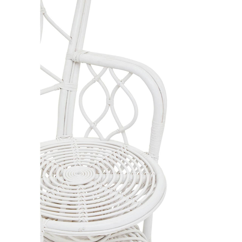 Curved chair made of natural rattan with a grey and white color scheme, featuring a decorative backrest and a round, woven seat. The chair has a light, airy design suitable for indoor or outdoor use