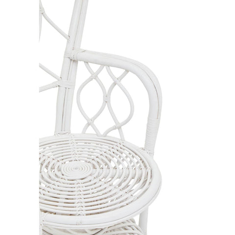 Curved chair made of natural rattan with a grey and white color scheme, featuring a decorative backrest and a round, woven seat. The chair has a light, airy design suitable for indoor or outdoor use