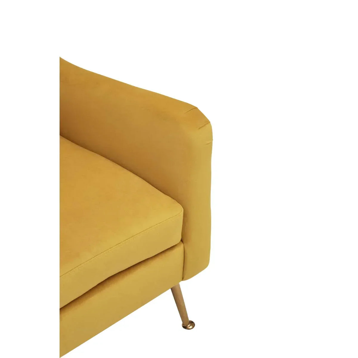 Mustard yellow sofa corner with metal leg and box cushion, close-up view