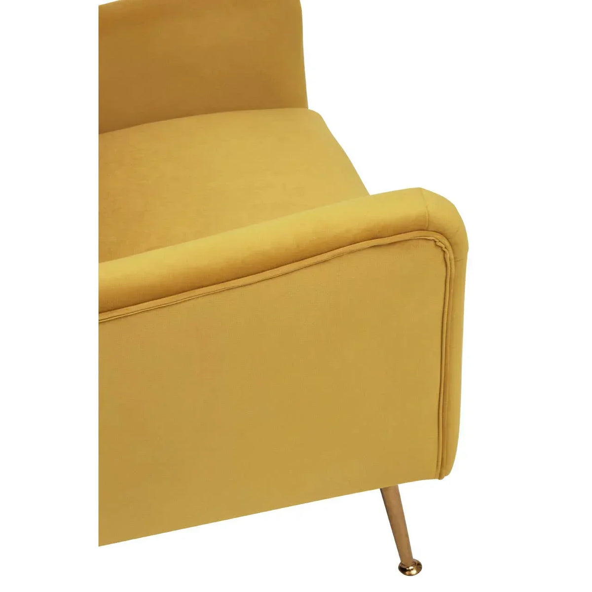 Mustard yellow sofa armrest with gold metal leg, close-up view