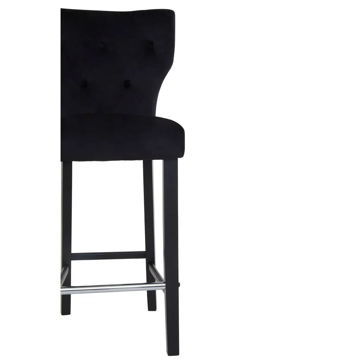 Black velvet bar stool with buttoned backrest and dark wooden legs, side view