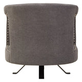 Grey fabric accent chair rear view with metal base and silver stud detailing