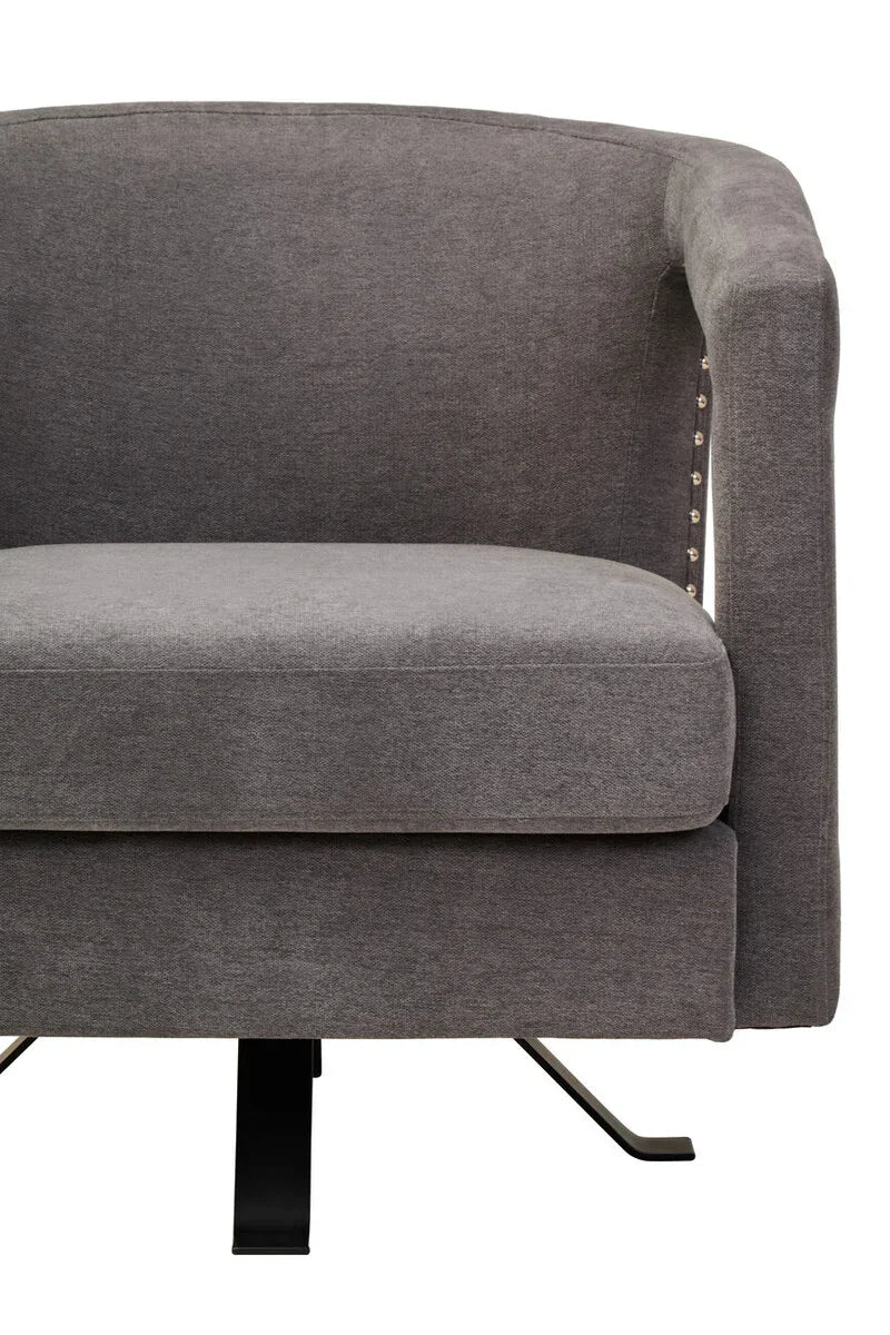 Grey fabric accent chair with metal base and stud detail on side, front view