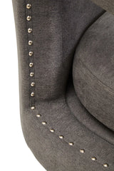 Grey fabric armchair with silver studded trim closeup