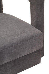 Closeup of grey fabric upholstered sofa seat cushion and armrest