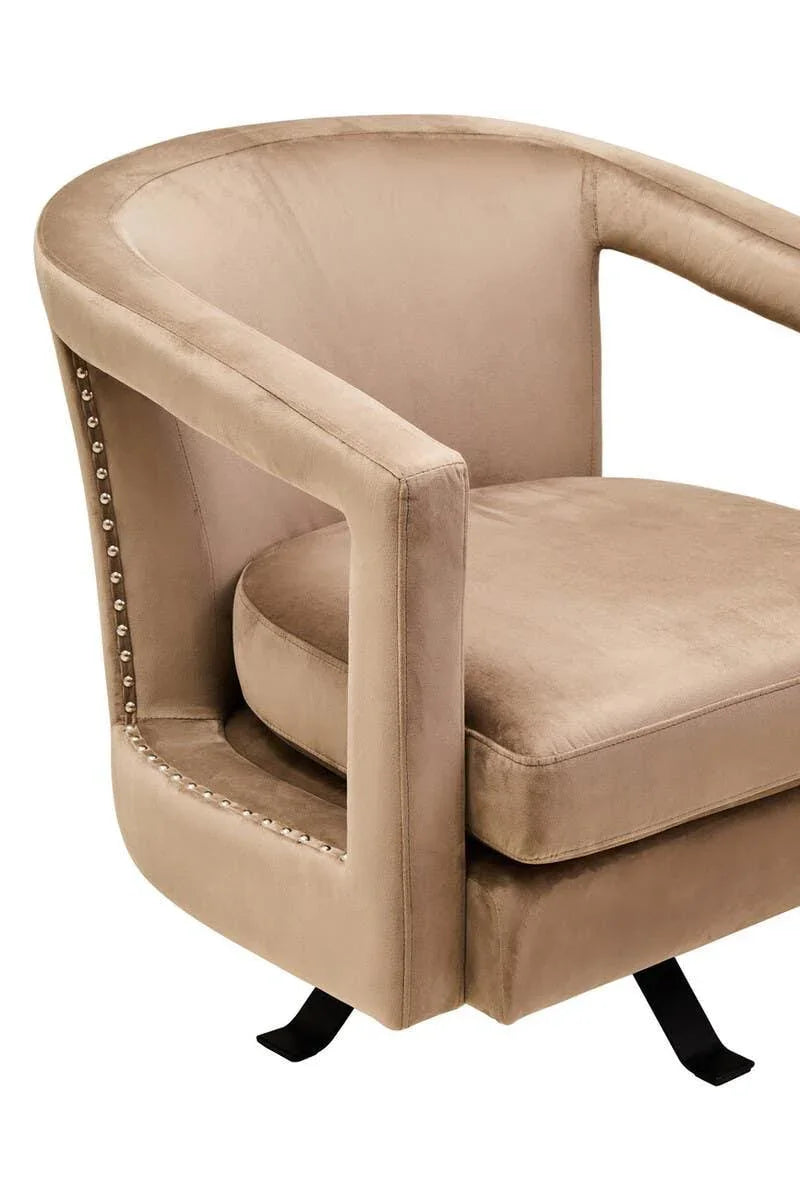 Beige velvet accent chair with rounded back and silver stud detailing