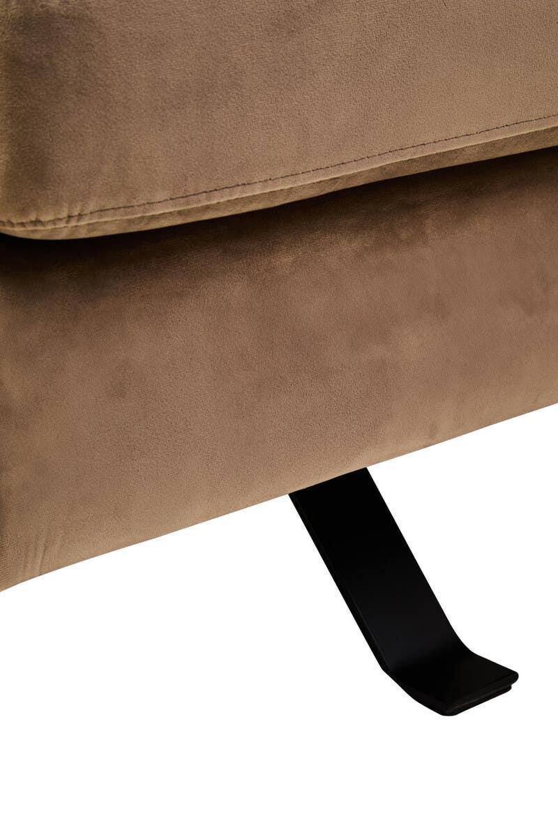 Close-up of tan fabric sofa cushion and black metal leg