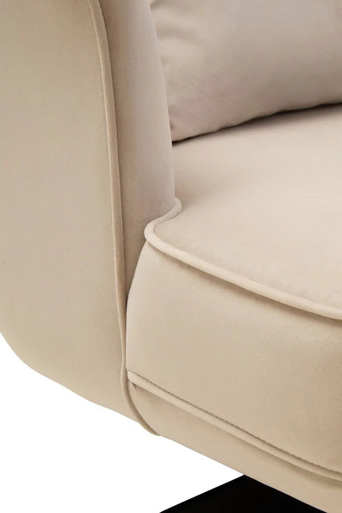 Close-up of beige fabric sofa armrest and cushion detail