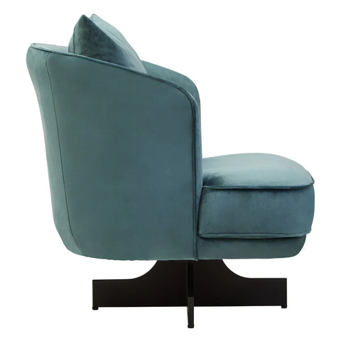 Side view of teal velvet accent chair with plush seat cushion and black metal base