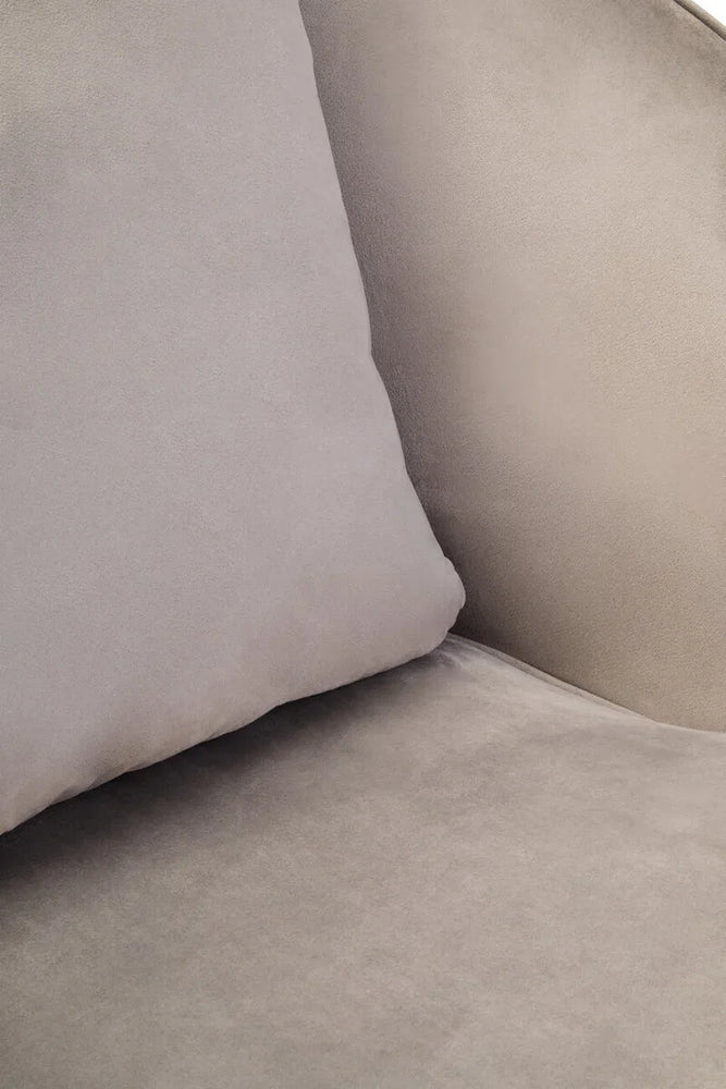 Close up of light grey velvet sofa cushion and seat