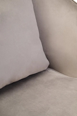 Close up of light grey velvet sofa cushion and seat