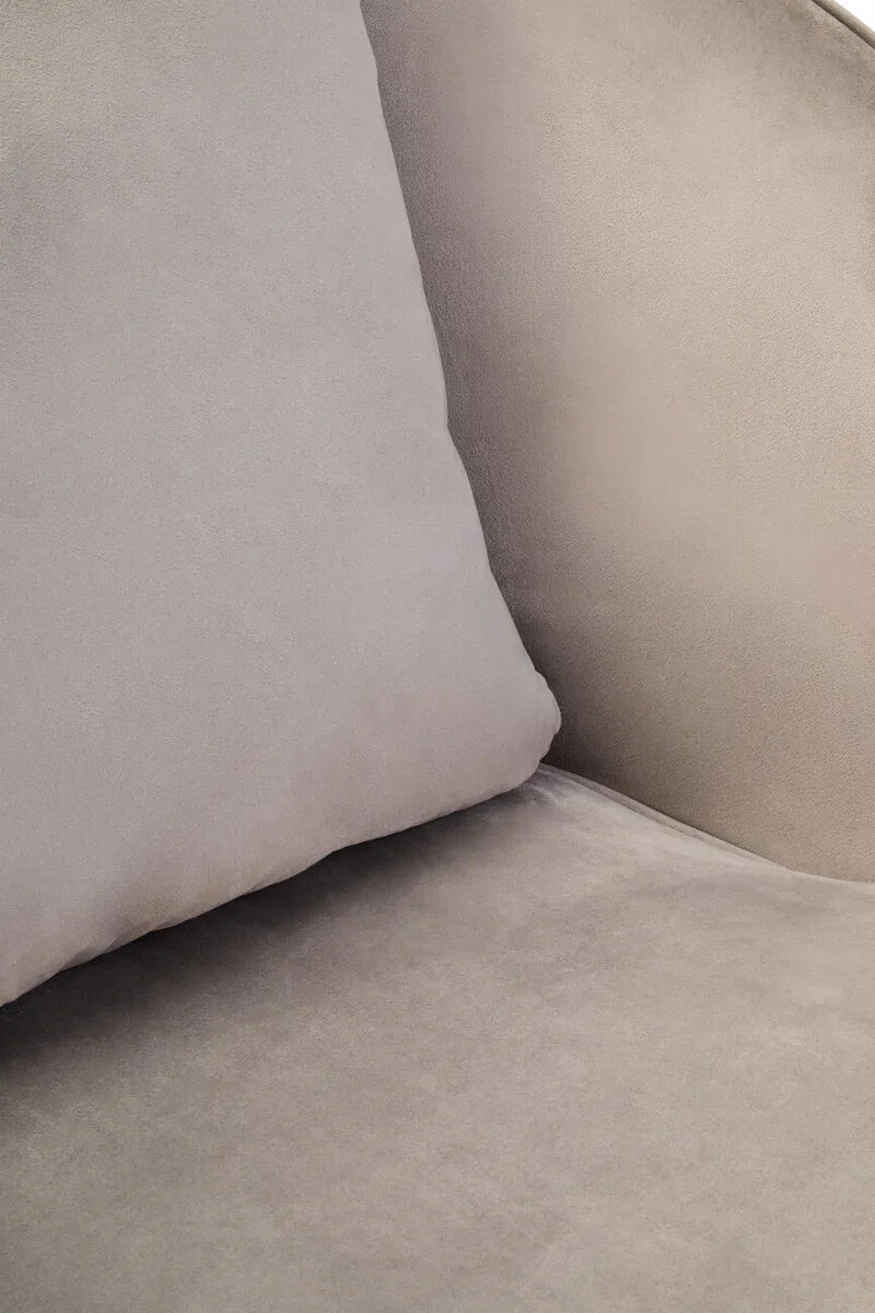 Close up of light grey velvet sofa cushion and seat