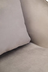 Close up of light grey velvet sofa cushion and seat