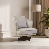 Beige swivel accent chair with cushion and dark wood base in living room setting