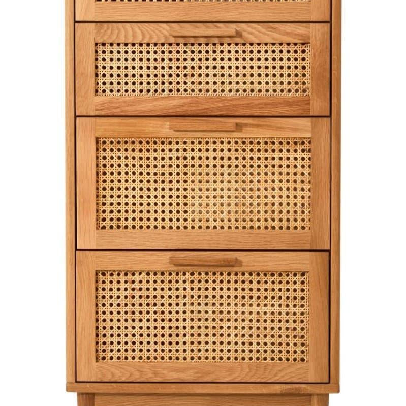 Tall wooden chest of drawers with cane panel fronts and angled legs