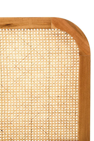 Close-up view of a double bed headboard featuring a natural rattan center with a smooth oak wood frame. The headboard has rounded corners and a light wood finish, showcasing a blend of textures and materials