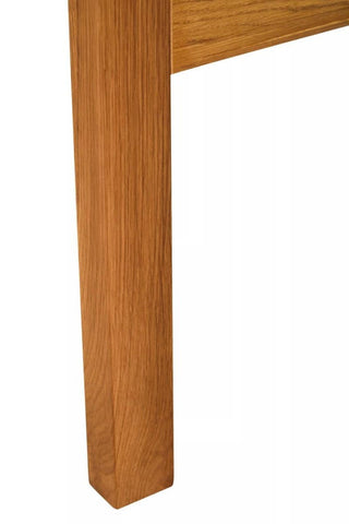 Close-up view of a sturdy oak wood leg of a bed headboard, showcasing a smooth finish and natural wood grain. The leg is square-shaped with clean edges, emphasizing the quality craftsmanship of the furniture piece