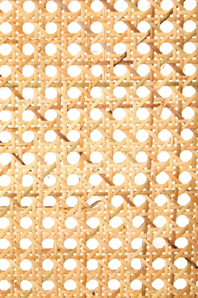 Close-up view of a rattan and oak wood double bed headboard featuring a woven pattern with a natural finish, showcasing the intricate texture and craftsmanship of the material