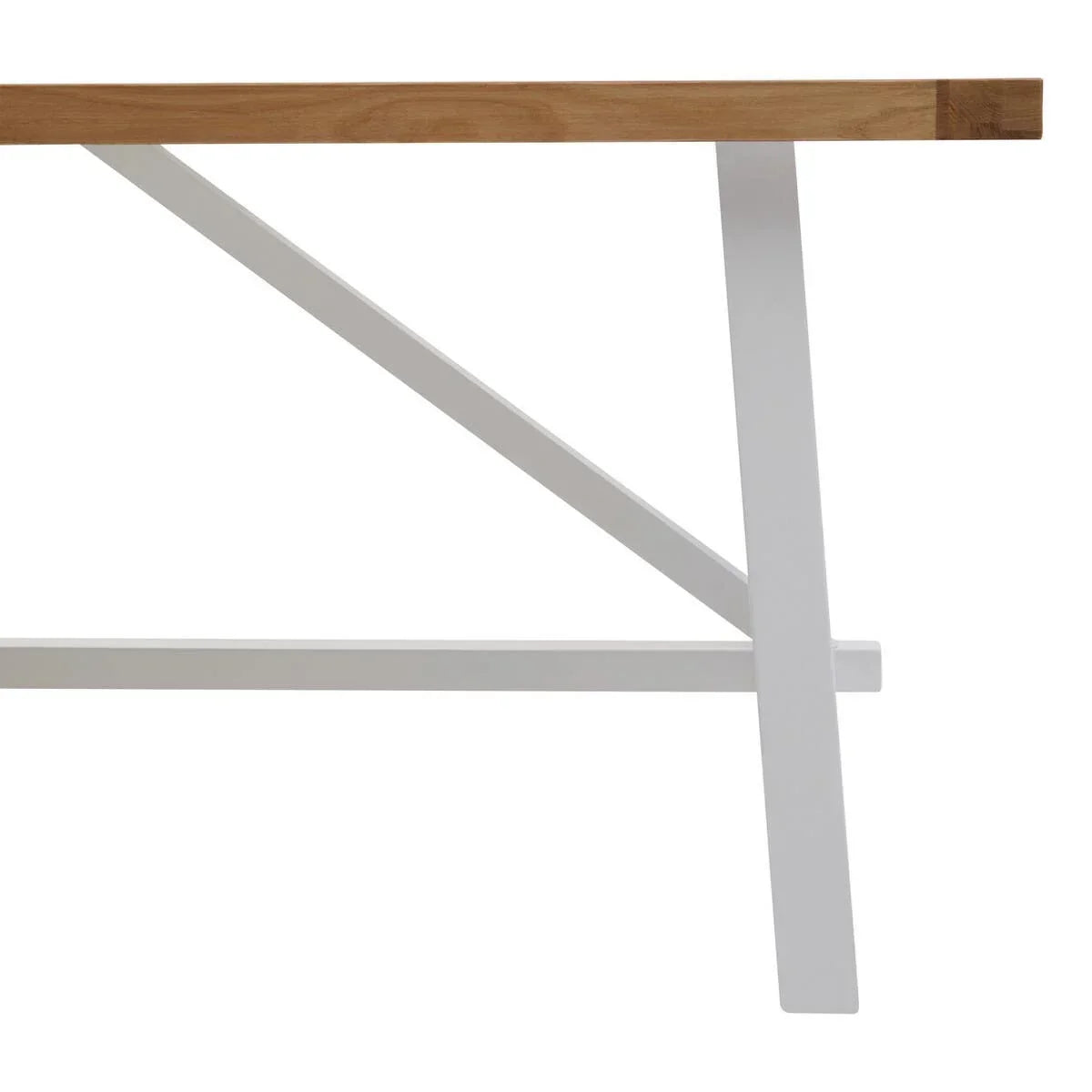 Wood dining table edge with white angled metal legs, side view detail