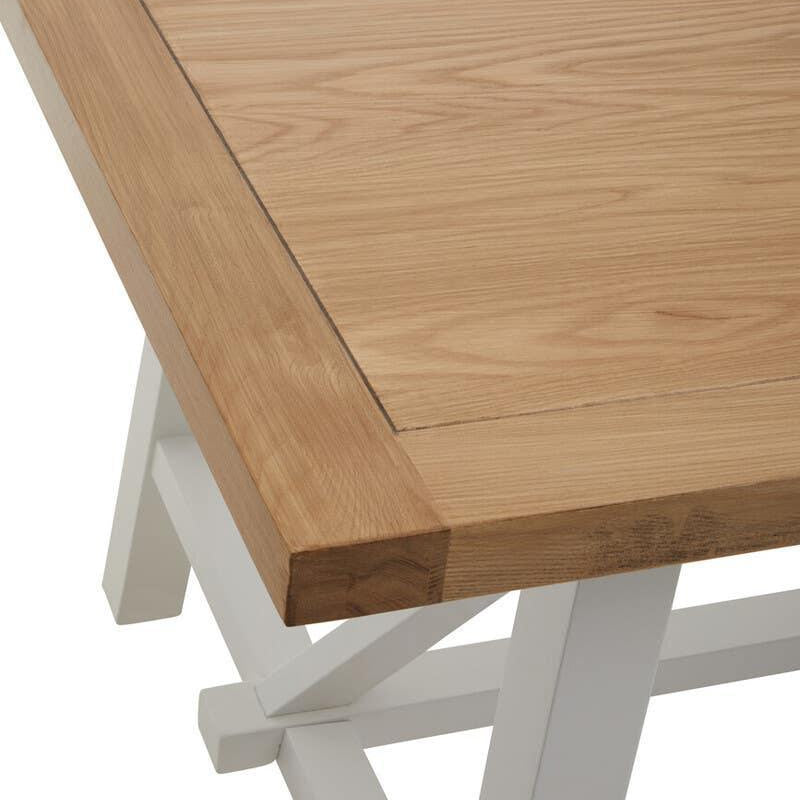 Oak dining table with white legs, close-up of tabletop and corner detail
