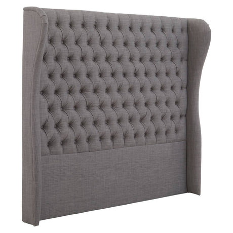 Kingsize headboard in a soft grey fabric featuring a tufted design with button detailing and a stylish wingback shape, providing an elegant and modern touch to bedroom decor